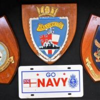 3 x hand painted Navy and Air Force wall plaques on timber shields incl 180 Squadron, RAAF and HMA Corvettes plus plastic 'Go Navy' number plate - Sold for $62 - 2019