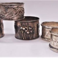 5 x Silver and other napkin rings incl Hallmarked English silver and two unmarked Japanese Art Nouveau with enamel highlights - Sold for $43 - 2019