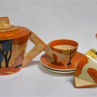 Art Deco Clarice Cliff style Teapot & 4 cups and saucers - orange ground,  marked 1993 MMA - Sold for $112 - 2019