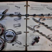 Group lot - Vintage Motoring items - 3 x Cragar Mag wheel centres, old HOLDEN SPECIAL & 186 Badges, Morris 1000 Manual, etc - Sold for $62 - 2019
