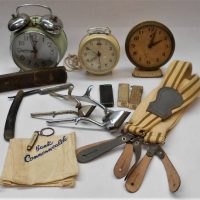 small box lot - assorted vintage items inc, Police and Fireman braces, cutthroat razor, bedside clocks, cigarette lighters, Grampians pen knife, Commo - Sold for $43 - 2019