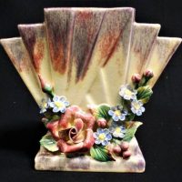 1930s Nell Sterling Australian pottery fan shaped vase - cream, pink, mauve soft tones with applied flowers - 16cms D - signed to base - Sold for $37 - 2019