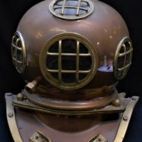 2 x items inc, large reproduction brass and copper diver's helmet and a wooden plant stand with a twist stem - Sold for $248 - 2019