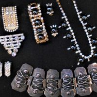 Group lot vintage costume jewellery - diamante dress clips, wide silver bracelet (af), brooch, gilt diamante and black stone necklaces, earrings & bra - Sold for $43 - 2019