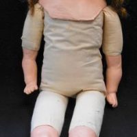 Large character Doll - plaster head shoulder, arms, and lower legs, glass fixed eyes, straw filled body - unmarked - approx 66cms L - Sold for $62 - 2019