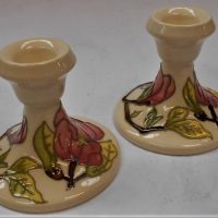 Pair of C1950s - 60s Walter Moorcroft candleholders in the Magnolia pattern, marked to base - approx 95cm H - Sold for $99 - 2019