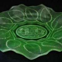 Vintage uranium glass dish with embossed rose and leaf decoration - approx 21cm long - Sold for $35 - 2019