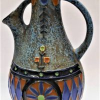 c1930's Amphora ceramic handled jug mottled blue with raised decoration - 23cm tall - Sold for $35 - 2019