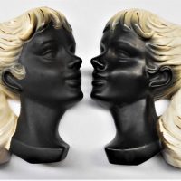 Pair of c1950's figural girl ceramic wall pockets - black and white, no marks sited - Sold for $37 - 2019