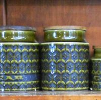 Set of 7 retro green Hornsea, England ceramic canisters with wooden lids - graduating sizes - Sold for $37 - 2019