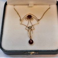 Pretty Art Nouveau 9ct gold Necklace - pendant suspended on chain with two claw set Garnets and seed pearl - Sold for $236 - 2019