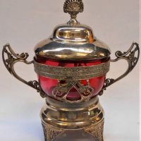 Victorian ornate silver plated lidded biscuit jar with ruby glass insert - approx 25cm H - Sold for $62 - 2019