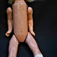 c1900 Doll - bisque head, composition body, articulated arms, legs, painted eyes - 20cms L - Sold for $37 - 2019