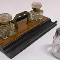 Group lot - twin wooden desk stand with sculptures glass ink bottles & glass ink bottle - Sold for $43 - 2019