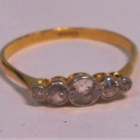 Ladies vintage 18ct ygold Diamond ring - central dia Approx 04 ct, 2 x 08 either side & 2 tiny dias - rubbed in setting - TW 2grms - Sold for $335 - 2019