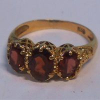 Ladies vintage 9ct ygold ring - high filigree setting with three claw set oval garnets - TW 26grms - Sold for $137 - 2019