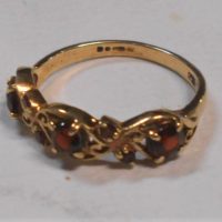 Pretty ladies  9ct ygold ring with 3 x claw set garnets & 4 x small - hmarked - TW 18 grms - Sold for $106 - 2019