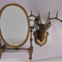 2 x brass items inc, wall mounted stag head and a table-top oval swing vanity mirror - Sold for $43 - 2019