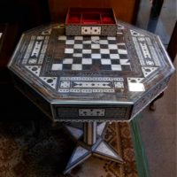 C192030's Anglo-Indian games table standing on central column with bone and other inlaid design complete with 2 working drawers, af (needs work) - Sold for $62 - 2019