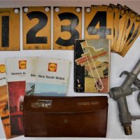 Group lot - assorted vintage items inc, Shell Farm Manual, Shell Map Pocket Calculator, Ampol and Shell road maps, black Numbers 1 - 10 on individual  - Sold for $56 - 2019