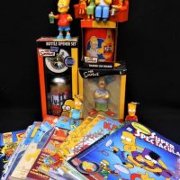 Small box lot assorted 'The Simpsons' merchandise incl comics, Bottle Opener Set, Talking Can Holder, figures, etc - Sold for $35 - 2019