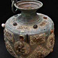 Vintage large Eastern copper urnvessel with embossed Buddha and other images, applied coloured stones, etc - approx36cm - Sold for $75 - 2019