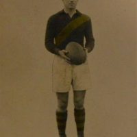 c1920 VFL black and white postcard A M Hislop - Richmond Football Club, hand touched yellow stripe - Sold for $43 - 2019