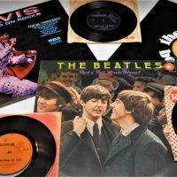 Small group lot The Beatles and Elvis Presley LP and single vinyl records incl The Essentials, Rock 'n' Roll Music, Raised On Rock, etc - Sold for $62 - 2019