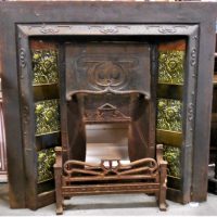 Ornate Art Nouveau Cast Iron Fire Place with raised whiplash floral motifs, grate and green tiles with raised floral design - Sold for $37 - 2019