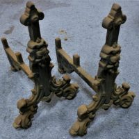 Pair of vintage cast iron fire dogs with embossed figure - Sold for $62 - 2019