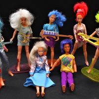 Box-lot-assorted-c1980s-Hasbro-Jem-and-the-Holograms-dolls-with-guitars-and-other-accessories-Sold-for-81-2019
