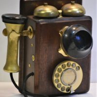 Vintage-wooden-wall-telephone-with-brass-rotary-dial-bells-and-brass-Bakelite-hand-and-mouth-pieces-Sold-for-161-2019