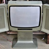 c1980s-Nordmende-Germany-Colour-Stereosonic-television-with-anodised-green-cabinet-and-hinged-speakers-to-cover-screen-Sold-for-37-2019