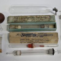 Group-lot-vintage-glass-medical-instruments-incl-3-x-glass-nose-syringes-1-with-box-boxed-Sheppard-blood-taking-tube-glass-tube-with-metal-fitting-Sold-for-35-2019