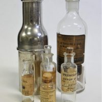 Small-lot-vintage-Pharmacy-Apothecary-bottles-most-with-original-paper-labels-inc-Syrup-of-Squill-Ipecacuanha-Wine-one-in-metal-case-etc-Sold-for-75-2019