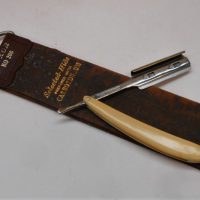 2-x-gents-vintage-shaving-items-inc-American-Omino-cut-throat-straight-razor-with-ivorine-handle-and-a-Luxoir-No-206-hide-strop-Sold-for-40-2019