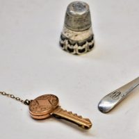 4-x-items-c1850-silver-Thimble-salt-spoon-hmarked-1909-gilt-enamel-locket-gold-lined-double-key-brooch-Sold-for-50-2019