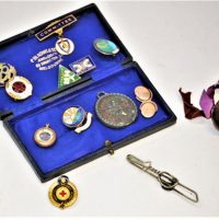 Group-lot-tiny-compass-enamel-badges-Hamilton-Base-Hospital-BBC-Radio-circle-N-Ireland-Masonic-Football-pin-with-ribbons-Brixlegg-revolving-Sold-for-56-2019