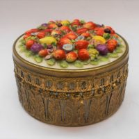 c1900-round-porcelain-box-in-gilt-ormalou-with-applied-fruit-flowers-to-lid-approx-13-cms-D-Sold-for-62-2019