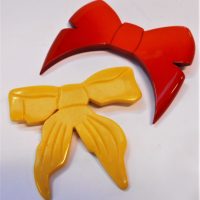 2-x-large-Bow-Brooches-red-Isadora-Paris-1930s-cream-Bakelite-Sold-for-62-2019