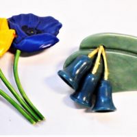 2-x-vintage-Brooches-1930s-tin-plastic-flowers-red-yellow-blue-Bakelite-Gum-leaf-with-blue-dangling-gumnuts-Sold-for-37-2019