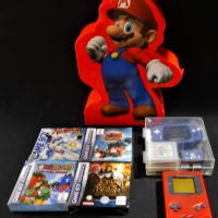 Box-lot-of-Nintendo-incl-Game-Boy-and-Game-Boy-Advance-consoles-with-games-Large-colourful-Super-Maria-Case-Sold-for-62-2019