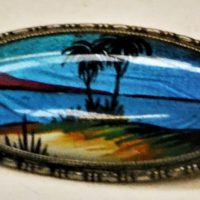 Vintage-enamelled-silver-badge-with-colourful-idyllic-beach-scene-Butterfly-wings-as-background-Sold-for-75-2019