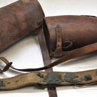 Pair-of-vintage-leather-Gaitors-and-WW1-webbing-belt-with-assorted-vintage-Australian-military-badges-Sold-for-68-2019