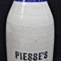 Vintage-stoneware-GINGER-BEER-BOTTLE-PIESSES-STONE-GINGER-BEER-Glazed-blue-neck-Sold-for-75-2019