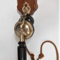 Vintage-wall-hanging-telephone-pre-dial-type-separate-handpiece-and-wall-mount-bell-on-shield-shape-backing-Purported-to-be-from-7-Creeks-homestea-Sold-for-143-2019