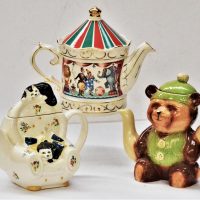 3-x-novelty-china-tea-pots-inc-vintage-Tony-Wood-Teddy-bear-shaped-Wade-cats-on-an-armchair-and-a-Sadler-Circus-themed-all-approx-17cm-H-Sold-for-50-2019