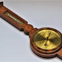 Early-1900s-ornate-wall-barometer-thermometer-with-brass-face-and-inlay-work-to-timber-approx-60cm-L-Sold-for-75-2019