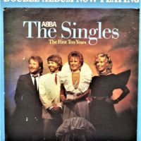 Vintage-ABBA-Point-Of-Sale-promotional-card-with-image-of-the-group-and-text-Double-Album-Now-Playing-The-Singles-The-first-Ten-Years-approx-40-Sold-for-50-2019