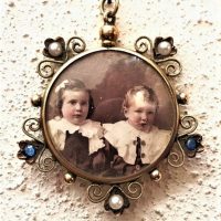 c1920s-double-sided-photo-locket-pendant-with-ornate-9ct-gold-surround-set-with-tine-sapphires-seed-pearls-Sold-for-236-2019